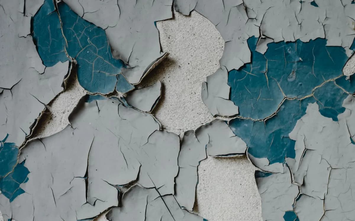 A cracked and stained masonry wall