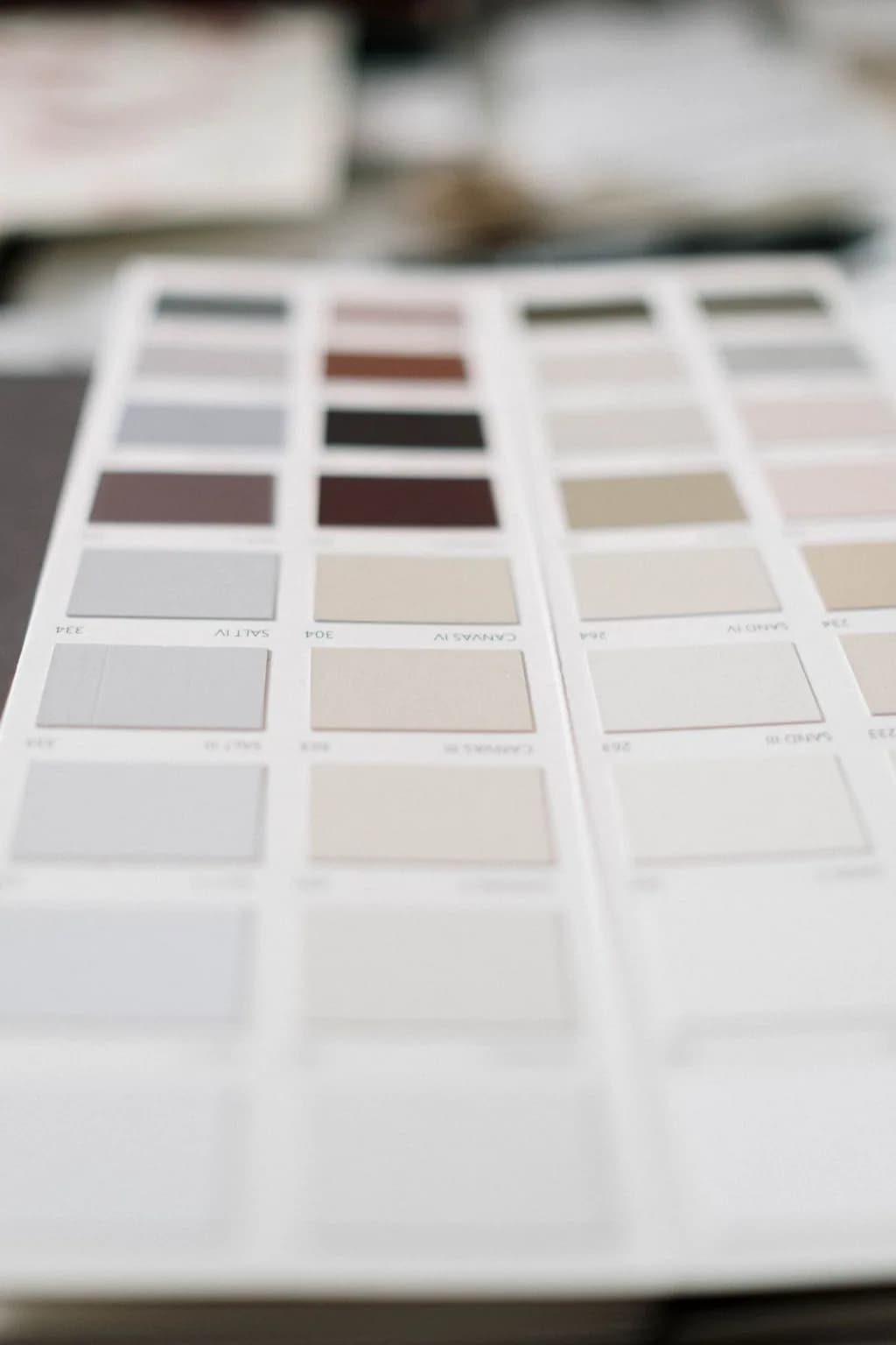 Paint colour chips laid out in tonal columns on a fan deck